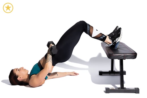 Woman doing a Glute Bridge using a bench and dumbbell.